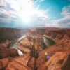 woman standing on top of canyon
